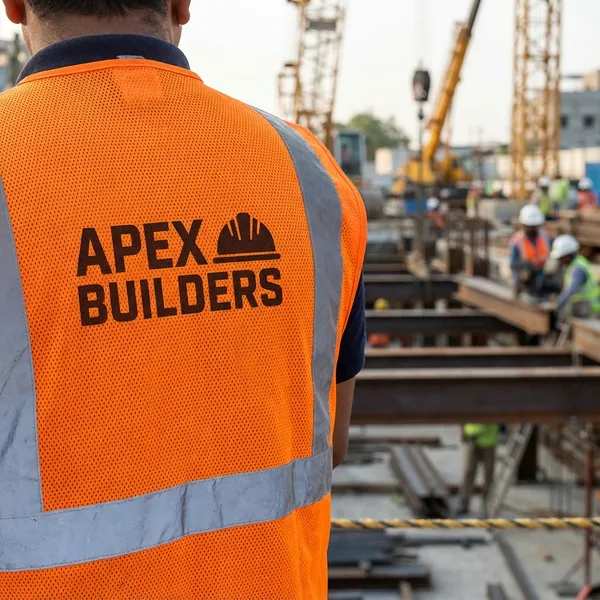 Uniformes de trabajo sublimados para empresa de construcción con logotipo corporativo